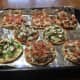 Mini Pizzas made on round flatbreads, ready for oven