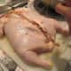 This chicken has been completely deboned, then filled with something fabulous, and is now ready to seal up and roast.