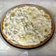 Mixture spooned into the graham cracker crust and smoothed even. Time to cover and refrigerate this banana split pie