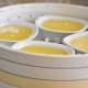 Step 3: Put the Juice in the dehydrator. (Juice in shallow pie dishes in dehydrator set up with separator racks.)