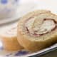 Strawberry jam and cream filled Swiss roll