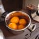 Simmer oranges in water for an hour