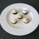 Sit the scallops carefully on top of the slices of black pudding
