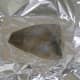 Plaice is seasoned and baked in foil with a little butter