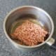 Add the raw lamb to a dry saucepan.