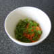 The grated carrot and cilantro/coriander are stirred through some cider vinegar to prevent discolouration.