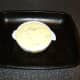 The cooled mashed potato is spread over the whiting and sauce
