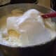 Incorporating the beaten egg whites into the batter for Italian Cream Cake.