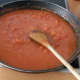 Stir in the stock and the chopped tomatoes