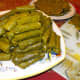 Stack your finished grape leaves and continue working until you've used up all your filling