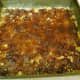 Cover the pressed mixture with the cooked date mixture.