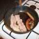 Frying the meat components of the breakfast