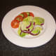 Simple salad accompanies the baked sardine