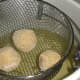 Frozen croquettes placed in deep-fryer set at 350 degrees.