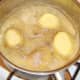 Potatoes are added to frothing butter