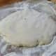 Turn the dough onto a generously floured board. Roll it over a couple of times and work in some of the flour.