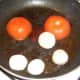 Frying tomato and mushrooms in steak juices