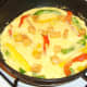 Mexicana cheese is crumbled over duck egg frittata