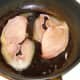 Bacon is added to pan vacated by sausages