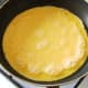 Starting to cook duck egg omelette