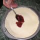 Now evenly spread your favourite jam on top of the pastry base.