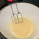 Beat all the eggs with a hand mixer in a large bowl until they are pale and full of air.