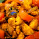 Chicken stir-fried with curry powder, cayenne, red pepper, onion, garlic, ginger and the very fragrant curry leaves.