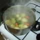 Water is added to stock pot and brought to a simmer