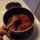 Simmering in sauce.