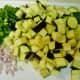 Cutting board with all of the veggies sliced, cubed and diced.