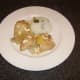 Cashew nuts are sprinkled over the chicken casserole