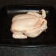 Olive oil is rubbed in to the chicken and more salt is added