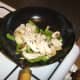 Chicken is added to stir fried vegetables to heat through