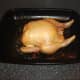 Roast chicken is cooked and ready to be rested