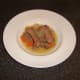 Beef casserole is plated and ready to be garnished