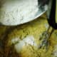 Add the sifted ingredients alternately with the dissolved baking soda into the creamed mixture.