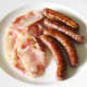Fry the sausages and bacon and then allow them to cool