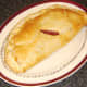 Sausage, bacon and tomato pasty, fresh from the oven