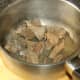 Beef steak is browned in oil