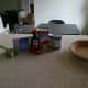 The ingredients for cherry cheesecake: cream cheese, condensed milk, lemon juice, vanilla, and cherry topping.