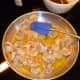 Saute the shrimp, then add spice and sherry mixture. 