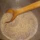 Reheat rice milk.