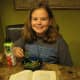 Here's Sophie eating her own recipe, green beans with turkey bacon! She makes these almost every night for us!
