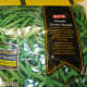Step 1: Take a package of frozen green beans. You can also use canned beans (or follow directions below for preparing fresh beans by parboiling them).