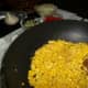 Add corn, salt, and pepper; brown corn until you hear a popping sound