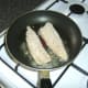 Frying the oatmeal coated mackerel fillets