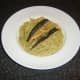 Mackerel fillets are placed on the spaghetti