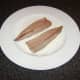 Mackerel fillets are patted in seasoned flour on their skin sides