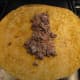 Spoon the mixture onto a tortilla wrap.