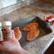 Sprinkle the seasoning on top of the chicken.